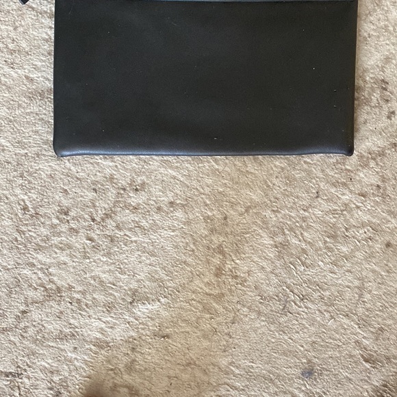 It’s a H and M bag black leather with gold points at the end and it’s spacious - Picture 3 of 7